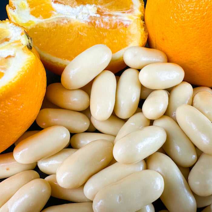 Dražejas ar apelsīnu cukātiem baltā beļģu šokolādē